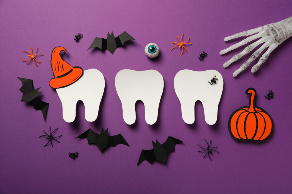 Illustration of teeth with Halloween decorations.