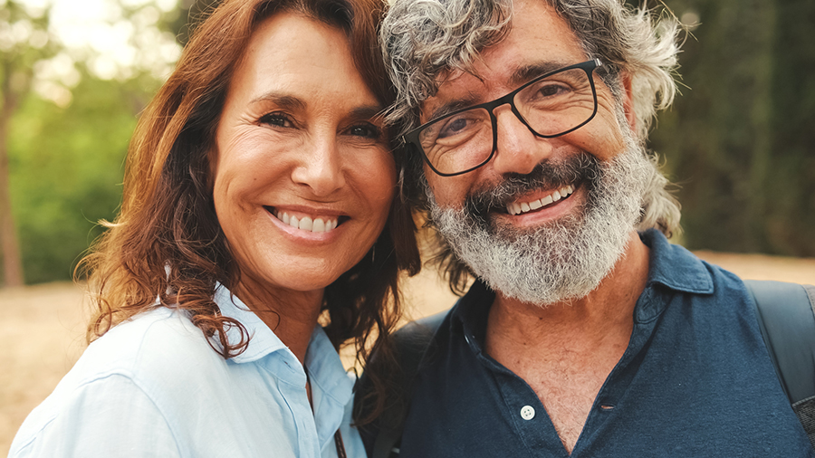 Close up, smiling older couple